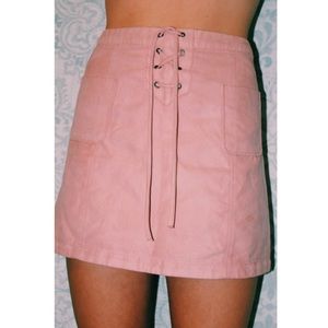 Light pink suede skirt.